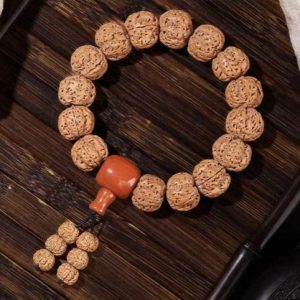 Exquisite Rudraksha Bracelet with Orange Accent, Featuring Intricate Textures and Traditional Design, Ideal for Jewelry Enthusiasts