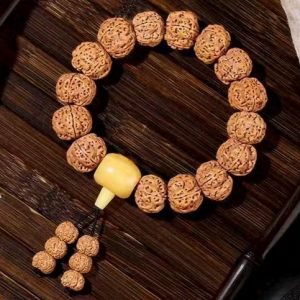 Exquisite Rudraksha Bracelet with Yellow Accent, Featuring Intricate Textures and Traditional Design, Ideal for Jewelry Enthusiasts